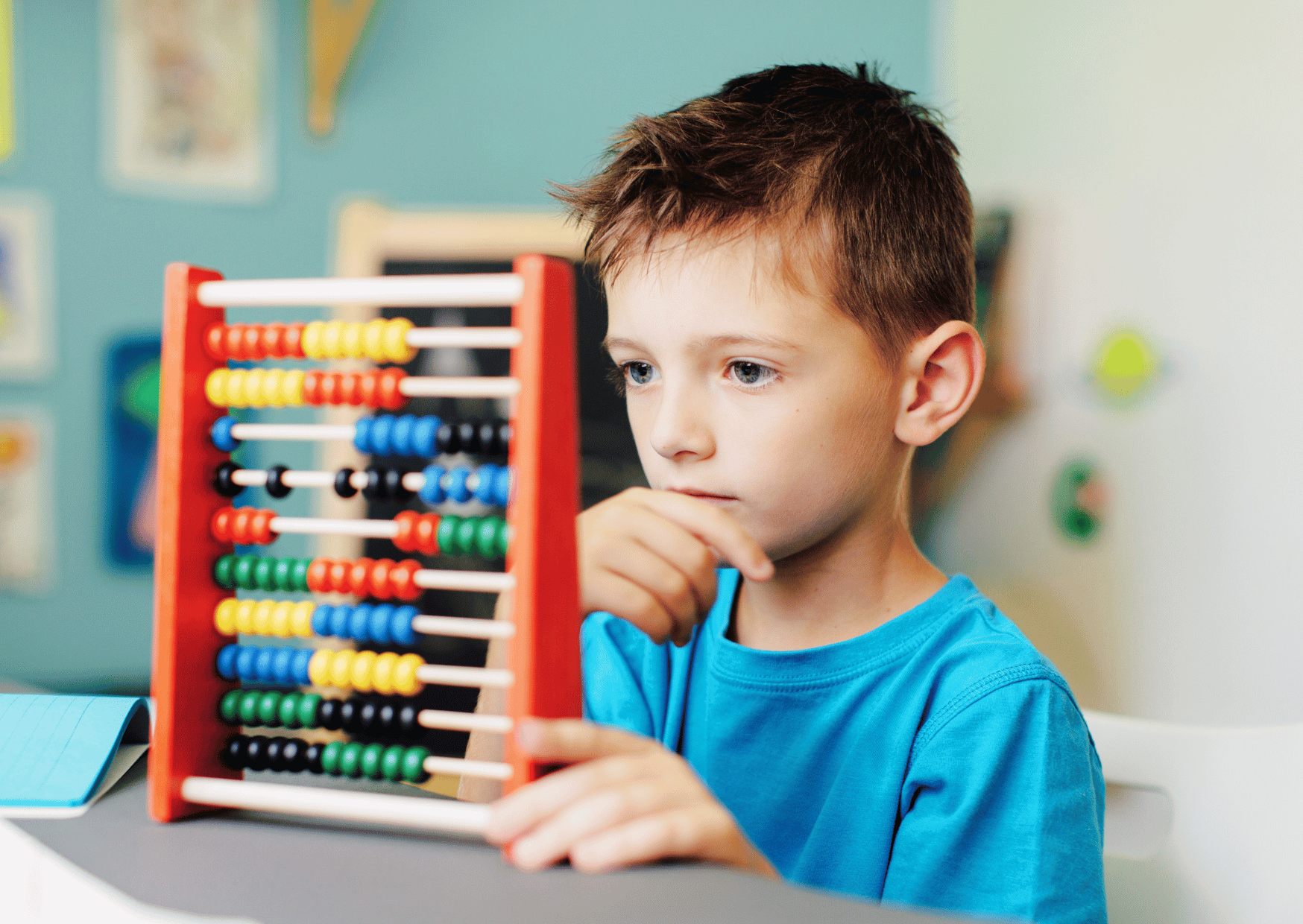 a boy concentrating on abacus 